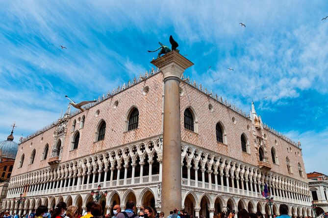 Skip the line Doge's Palace Guided Walking Tour in Venice - Entering through the courtyard and Golden Staircase