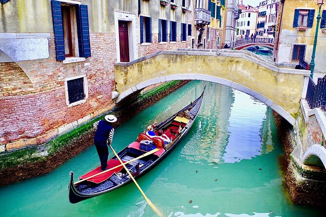 Venice: Enchanting City Walk & Majestic Gondola Glide! - The gondola ride: scenic, shared, and not private