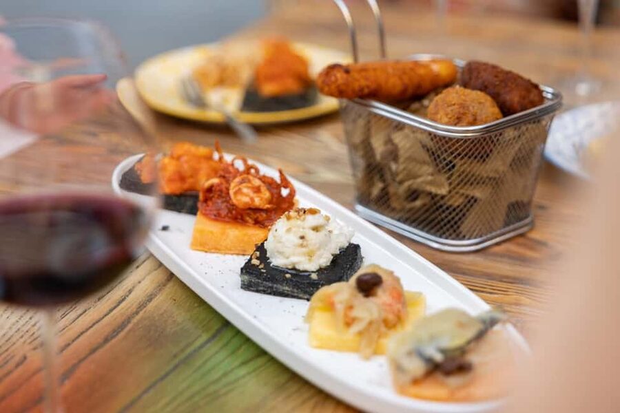 Venice Food Tasting Tour: Bites, Wine, Dinner & Local Guide - Second stop: coastal flavors and an ombra of wine