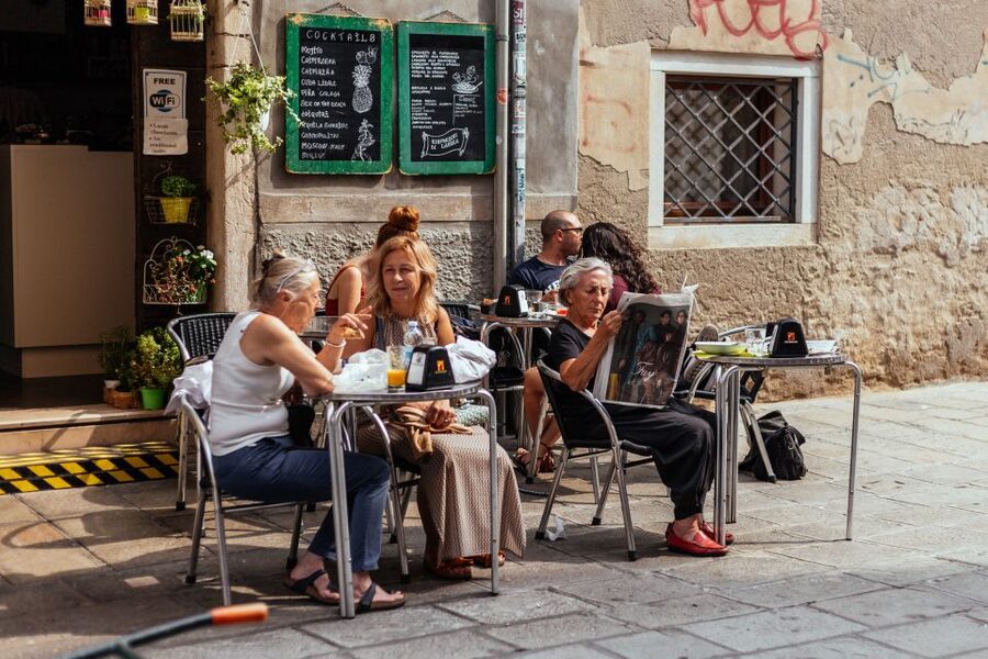 Venice: Off the Beaten Track Private City Tour - Street art beside old Venetian stone