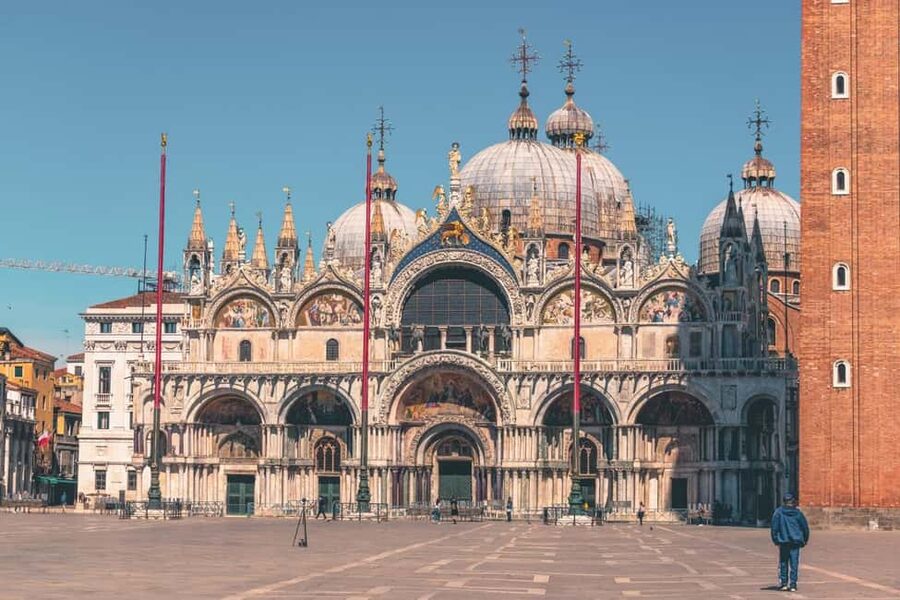Venice: St. Mark's, Doges Palace, Rialto, and Gondola Tour - Starting beneath the columns in St. Mark’s Square